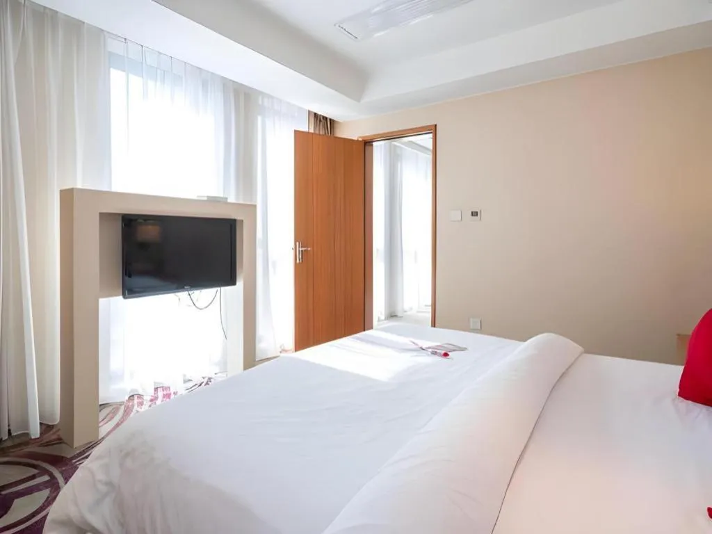 Bed in Jinjiang Metropolo Hotel - Taizhou Wanda Plaza