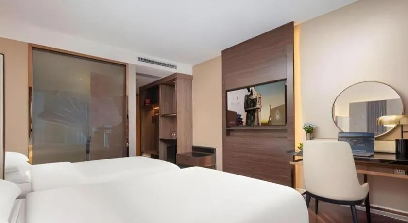 Bed in Jinjiang Metropolo Hotel - Taizhou Wanda Plaza