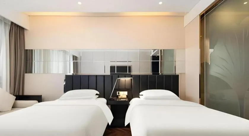 Bed in Jinjiang Metropolo Hotel - Taizhou Wanda Plaza