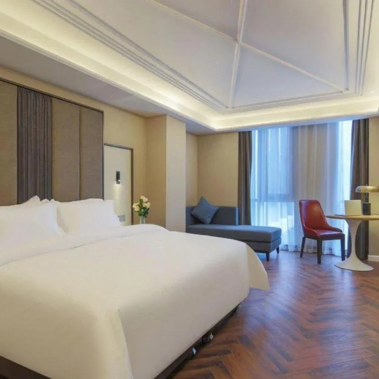Bed in Jinjiang Metropolo Hotel - Taizhou Wanda Plaza