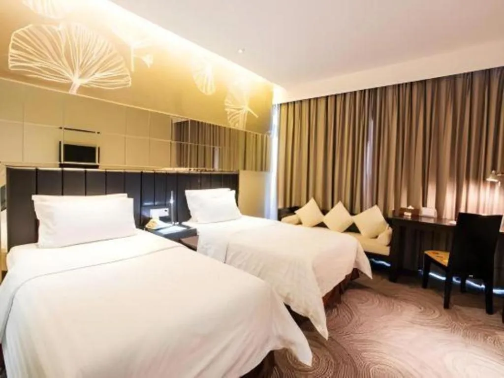 Bed in Jinjiang Metropolo Hotel - Taizhou Wanda Plaza