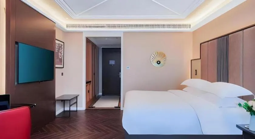 Bed in Jinjiang Metropolo Hotel - Taizhou Wanda Plaza