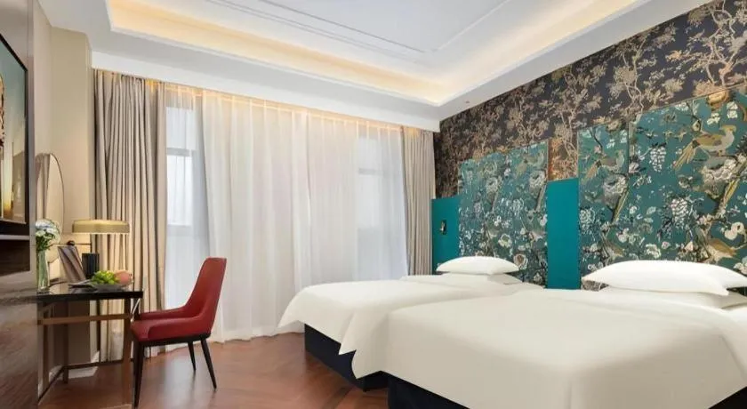 Bed in Jinjiang Metropolo Hotel - Taizhou Wanda Plaza