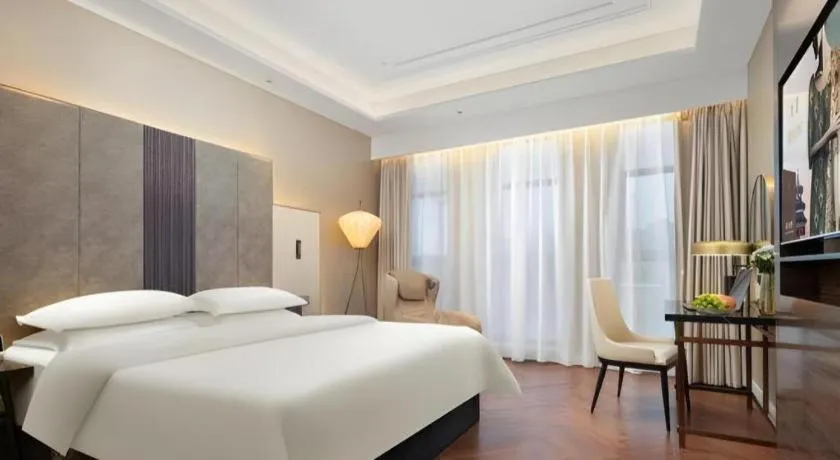 Bed in Jinjiang Metropolo Hotel - Taizhou Wanda Plaza