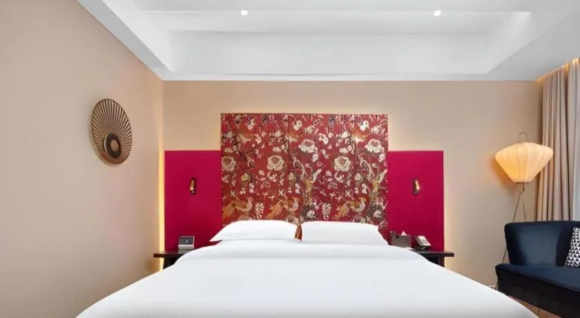 Bed in Jinjiang Metropolo Hotel - Taizhou Wanda Plaza