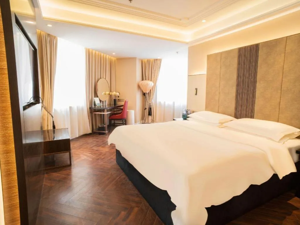 Bed in Metropolo Hotel Shijiazhuang Yuhua Wanda Plaza