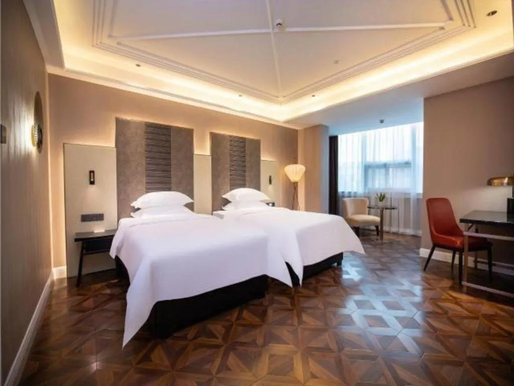 Bed in Metropolo Hotel Shijiazhuang Yuhua Wanda Plaza