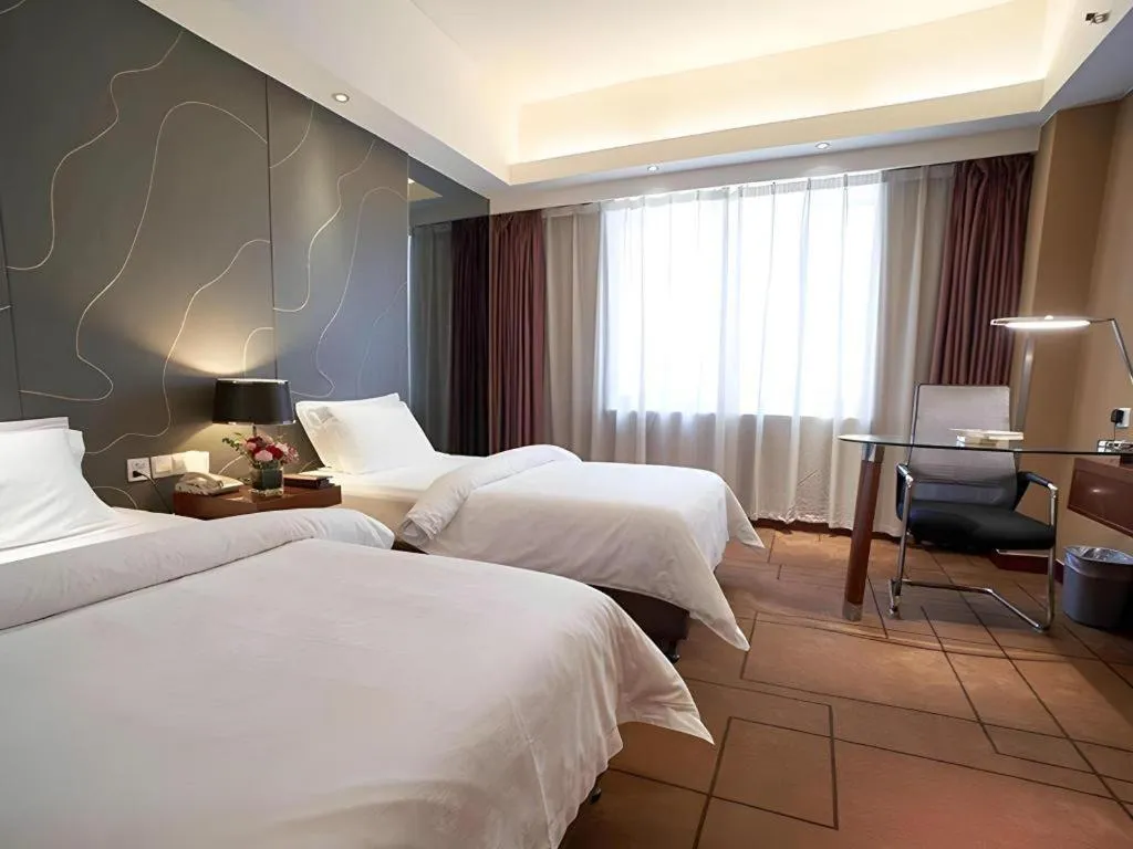 Bed in Metropolo Hotel Shijiazhuang Yuhua Wanda Plaza