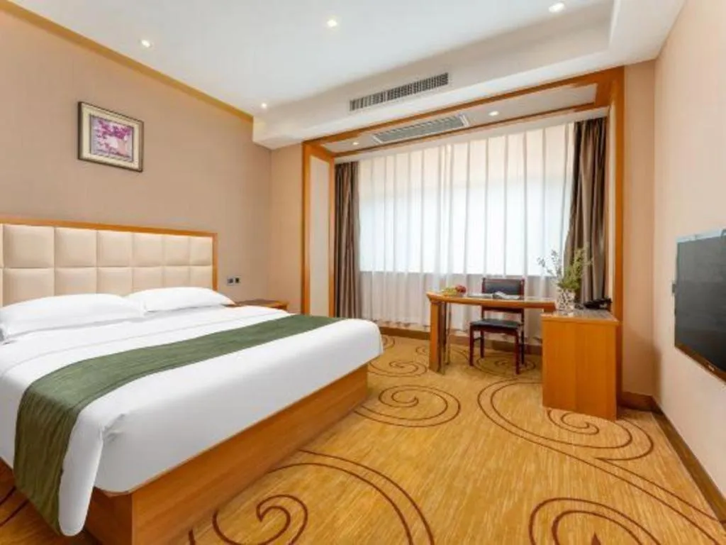 Bed in GreenTree Inn Shandong Taian Feicheng Xincheng Road Business Hotel