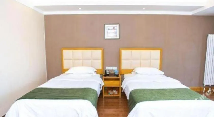 Bed in GreenTree Inn Shandong Taian Feicheng Xincheng Road Business Hotel