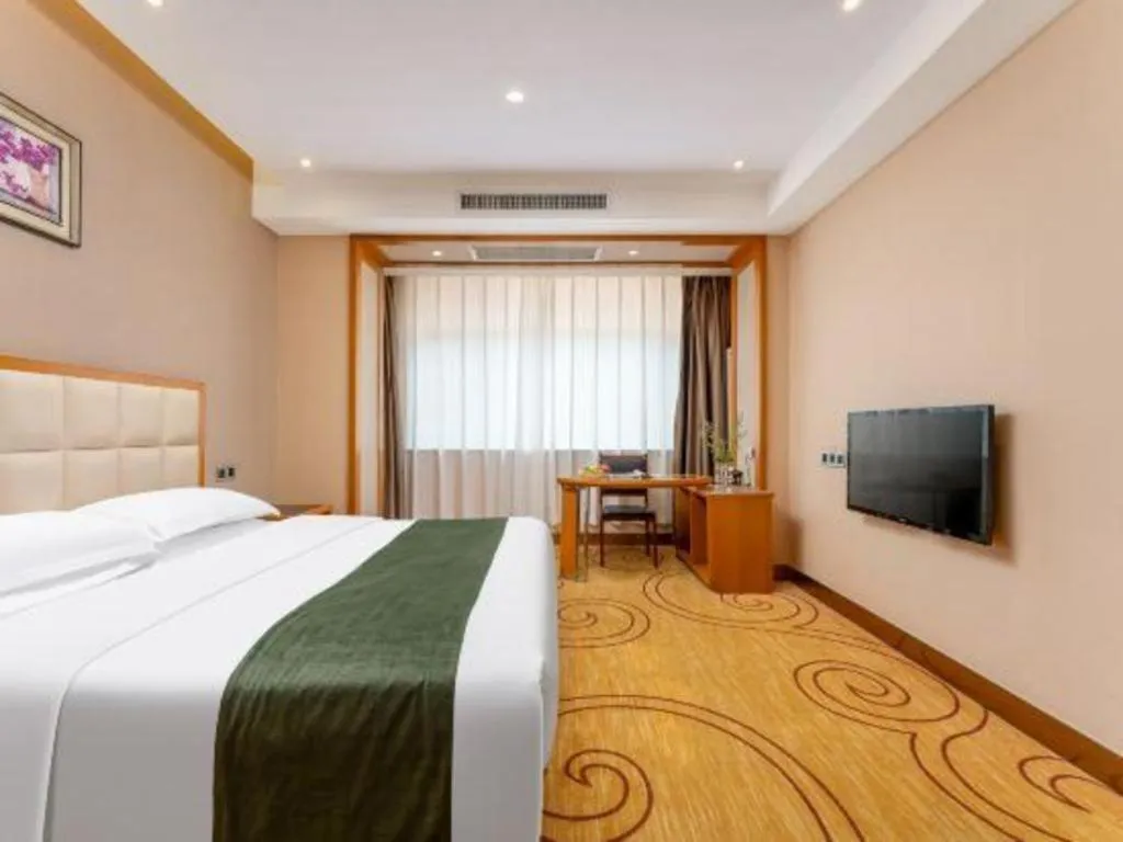 Bed in GreenTree Inn Shandong Taian Feicheng Xincheng Road Business Hotel