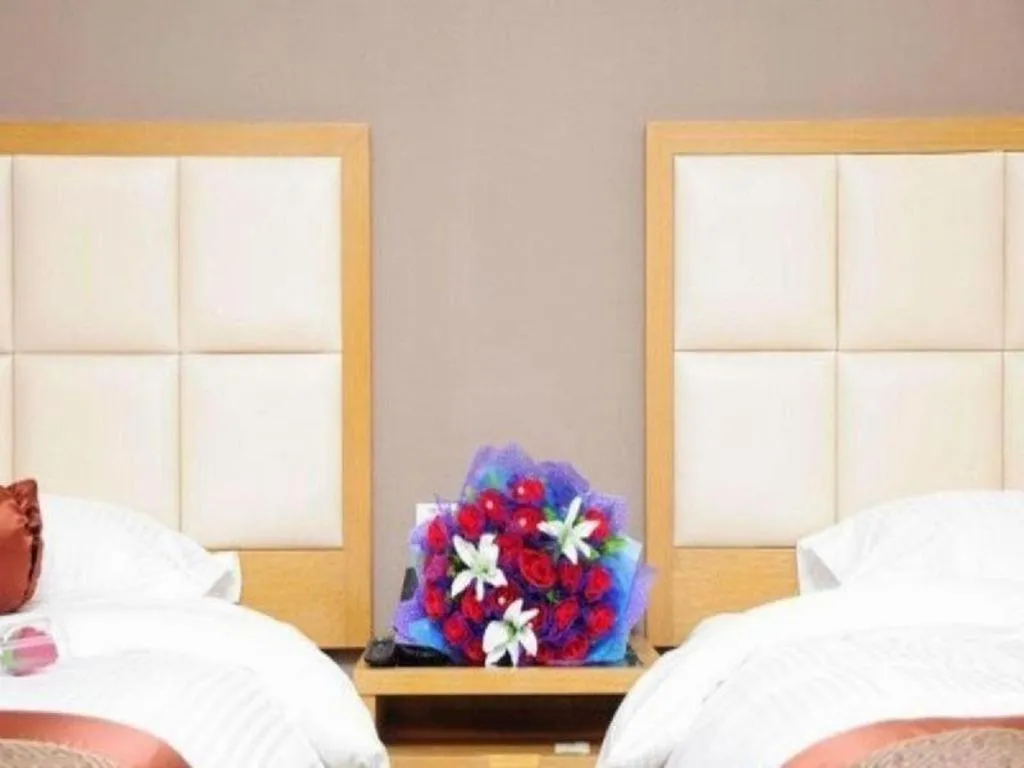 Bed in GreenTree Inn Shandong Taian Feicheng Xincheng Road Business Hotel