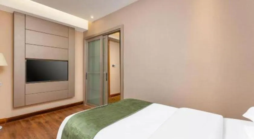 Bed in GreenTree Inn Shandong Taian Feicheng Xincheng Road Business Hotel