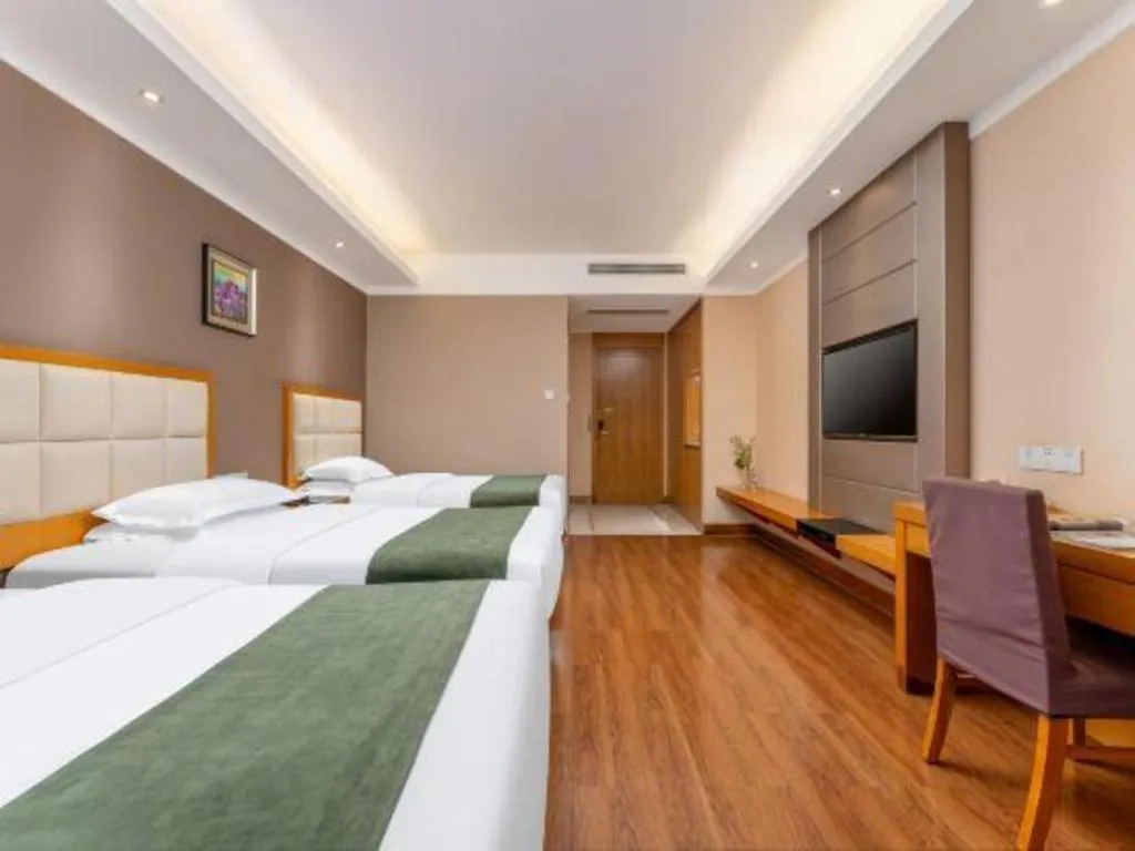 Bed in GreenTree Inn Shandong Taian Feicheng Xincheng Road Business Hotel