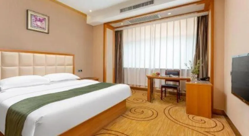 Bed in GreenTree Inn Shandong Taian Feicheng Xincheng Road Business Hotel