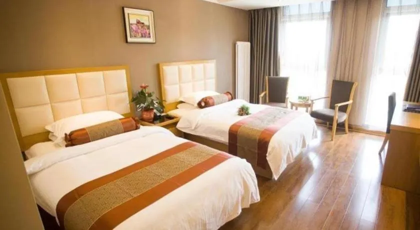 Bed in GreenTree Inn Shandong Taian Feicheng Xincheng Road Business Hotel