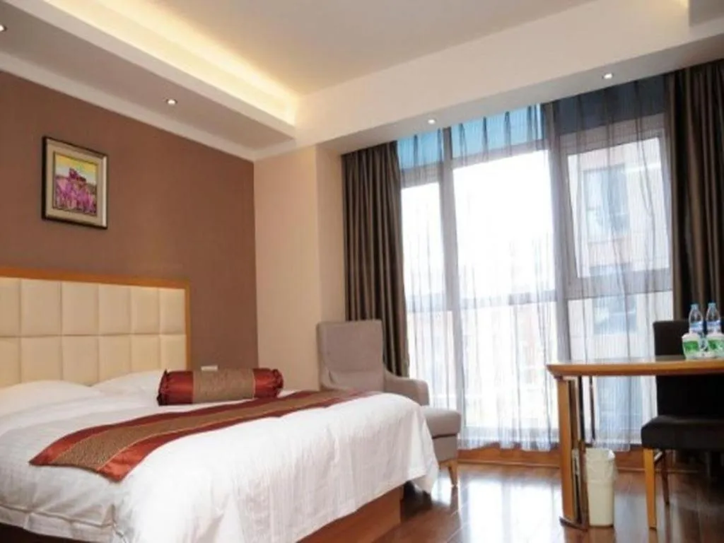 Bed in GreenTree Inn Shandong Taian Feicheng Xincheng Road Business Hotel