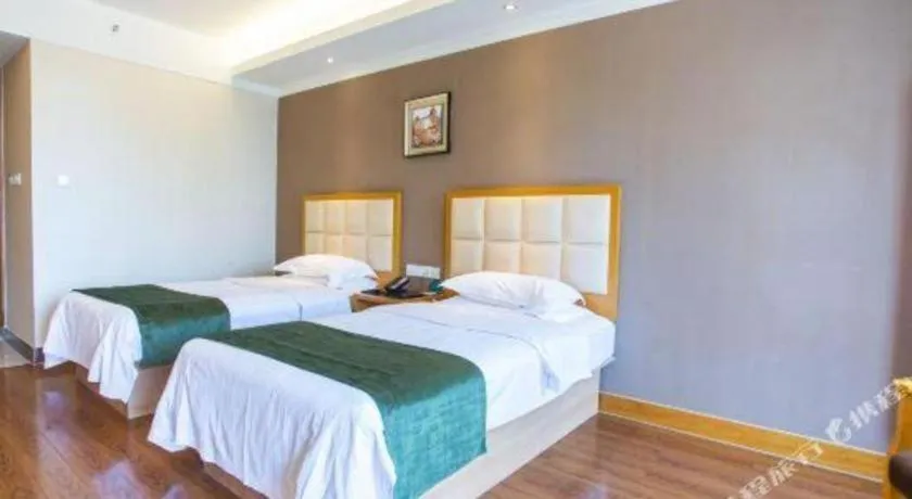 Bed in GreenTree Inn Shandong Taian Feicheng Xincheng Road Business Hotel