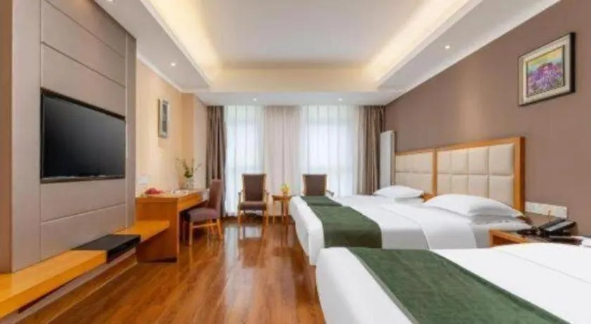 Bed in GreenTree Inn Shandong Taian Feicheng Xincheng Road Business Hotel