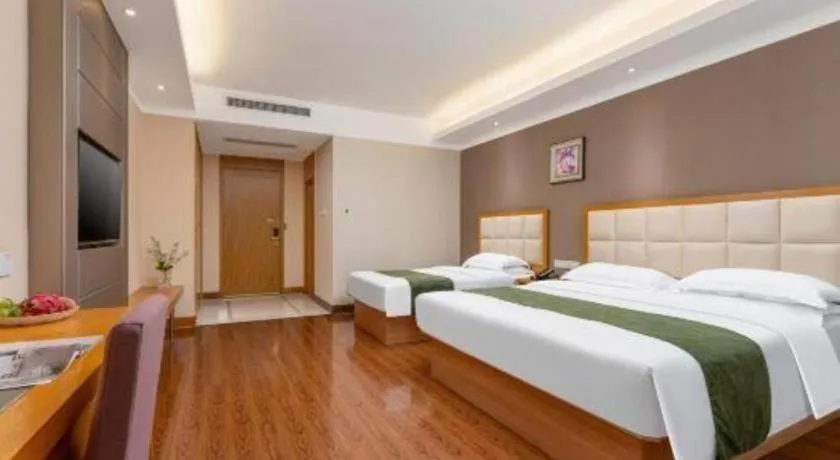 Bed in GreenTree Inn Shandong Taian Feicheng Xincheng Road Business Hotel