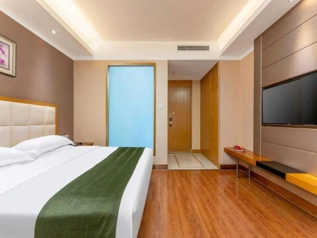 Bed in GreenTree Inn Shandong Taian Feicheng Xincheng Road Business Hotel