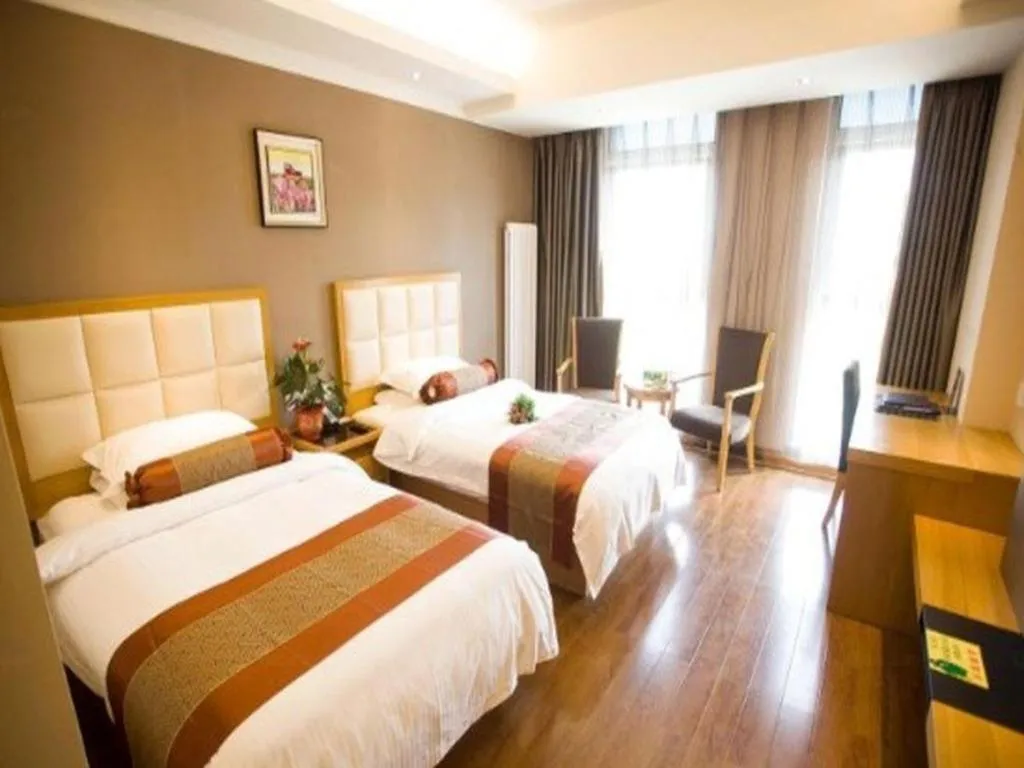 Bed in GreenTree Inn Shandong Taian Feicheng Xincheng Road Business Hotel
