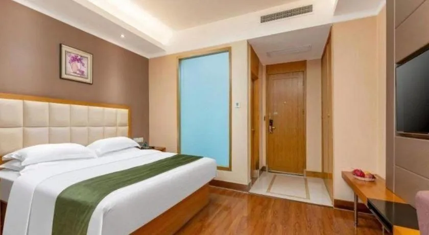 Bed in GreenTree Inn Shandong Taian Feicheng Xincheng Road Business Hotel