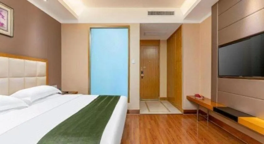 Bed in GreenTree Inn Shandong Taian Feicheng Xincheng Road Business Hotel