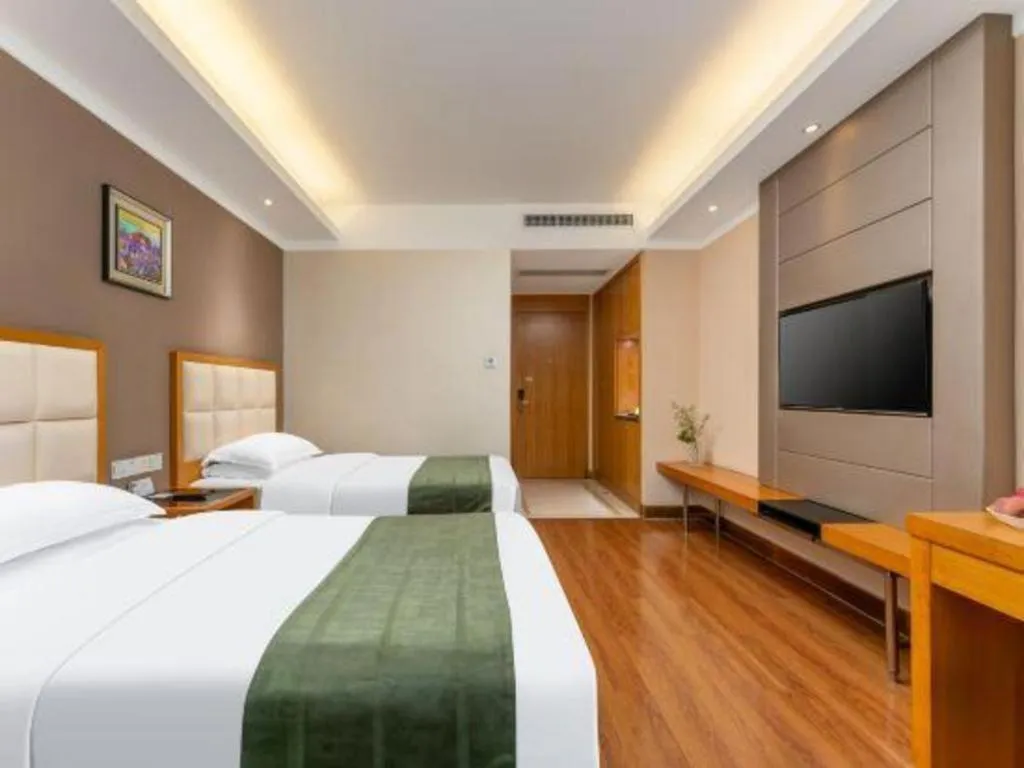 Bed in GreenTree Inn Shandong Taian Feicheng Xincheng Road Business Hotel