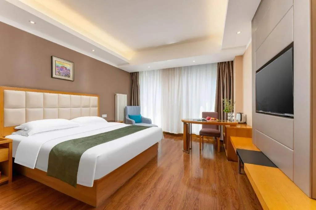 Bed in GreenTree Inn Shandong Taian Feicheng Xincheng Road Business Hotel