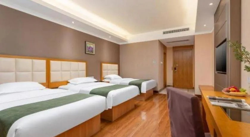 Bed in GreenTree Inn Shandong Taian Feicheng Xincheng Road Business Hotel