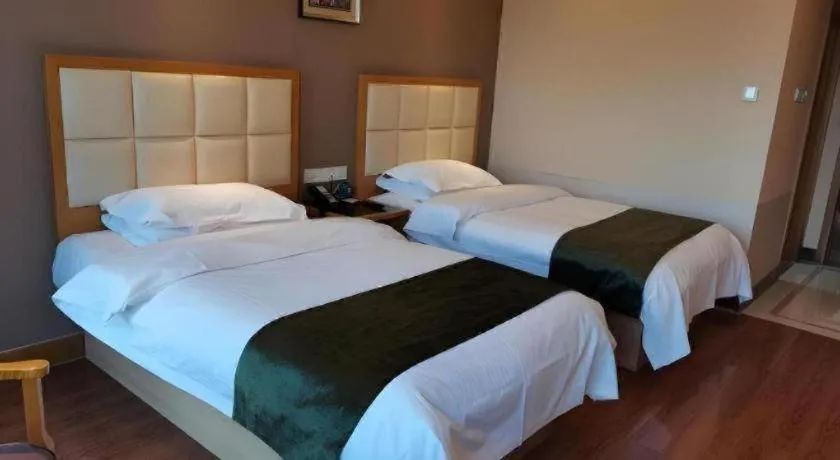 Bed in GreenTree Inn Shandong Taian Feicheng Xincheng Road Business Hotel