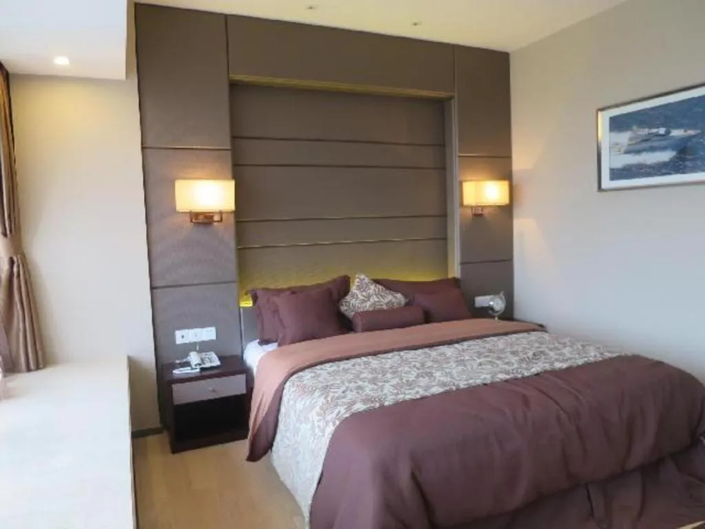 Bed in FOGER YACHT HOTEL