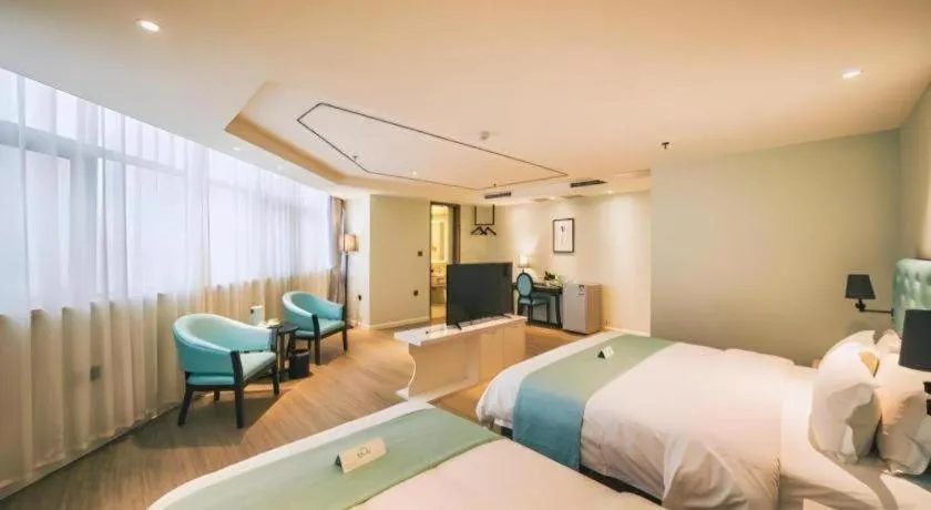 Bed in Qingdao Galaxy Holiday Hotel