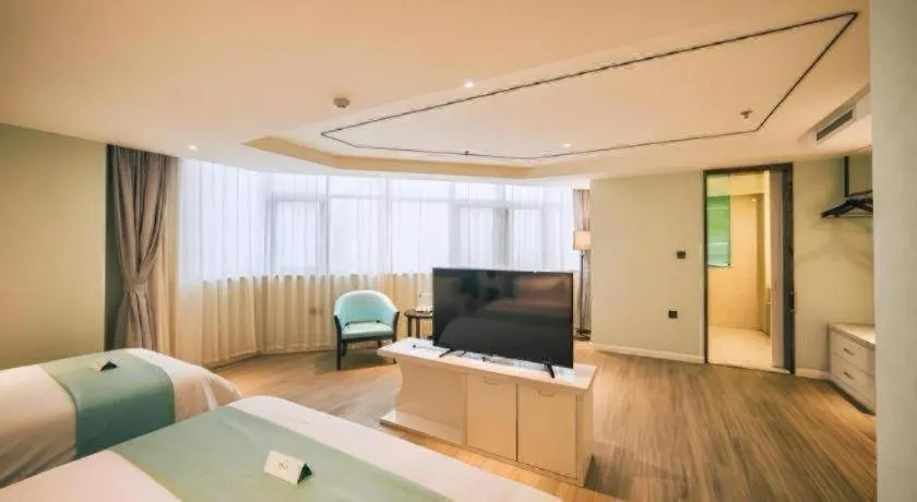 Bed in Qingdao Galaxy Holiday Hotel