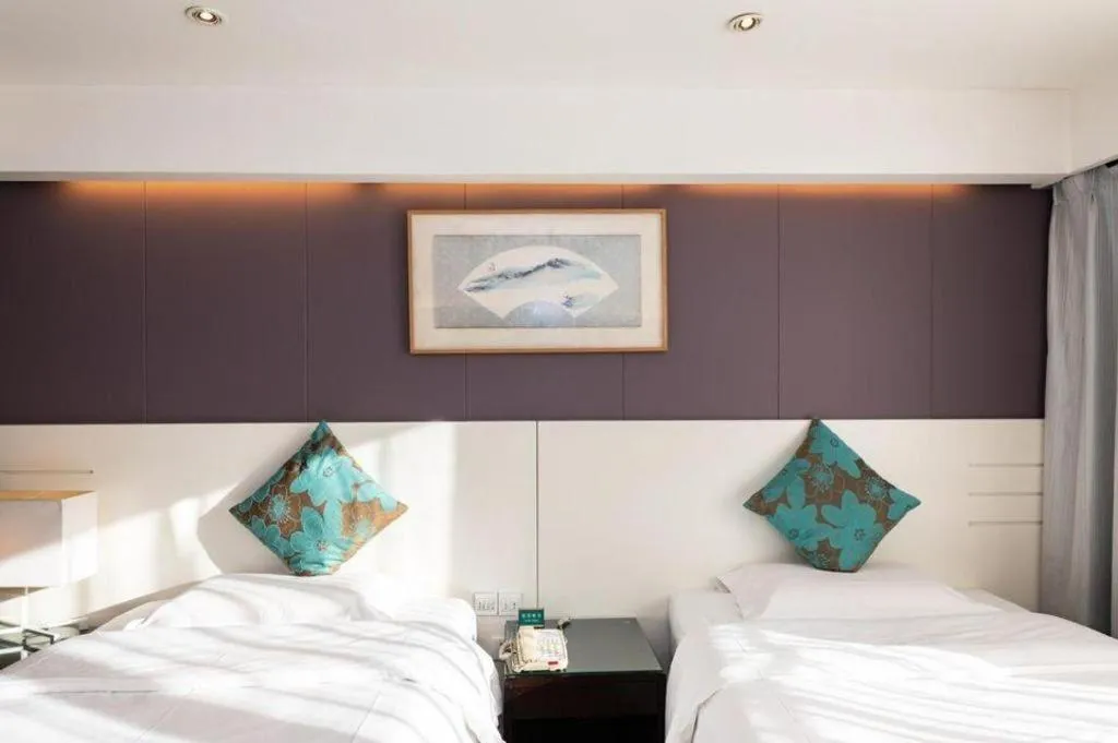 Bed in Tianjin Juchuan Lily Hotel