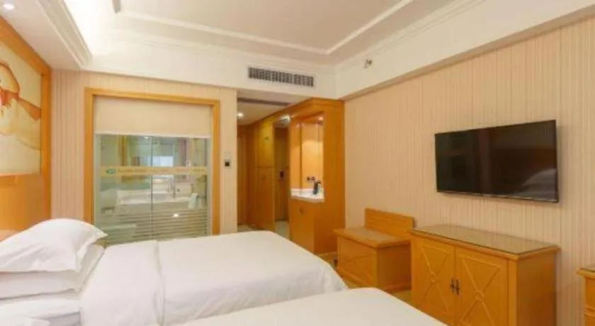 Bed in Vienna Hotel Guangxi Liuzhou Xijiang Vientiane City