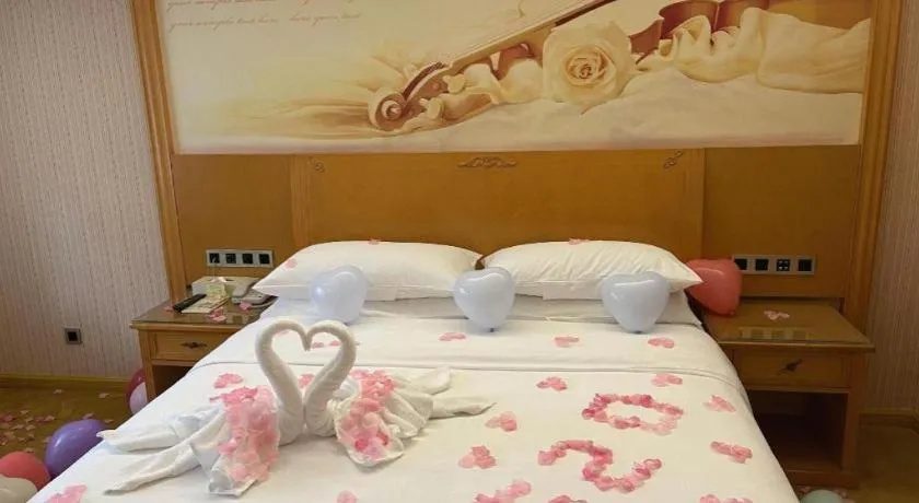 Bed in Vienna Hotel Guangxi Liuzhou Xijiang Vientiane City