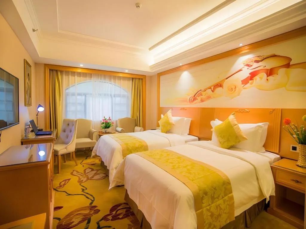 Bed in Vienna Hotel Guangxi Liuzhou Xijiang Vientiane City