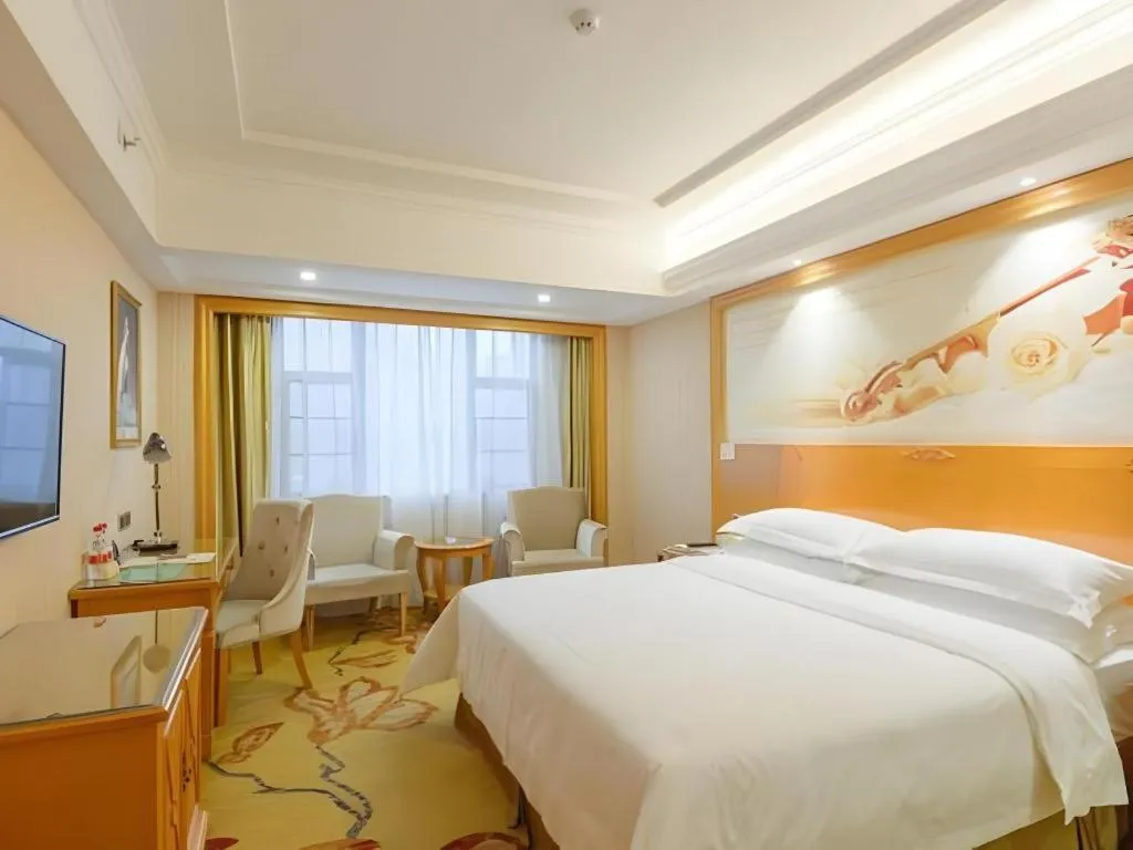 Bed in Vienna Hotel Guangxi Liuzhou Xijiang Vientiane City
