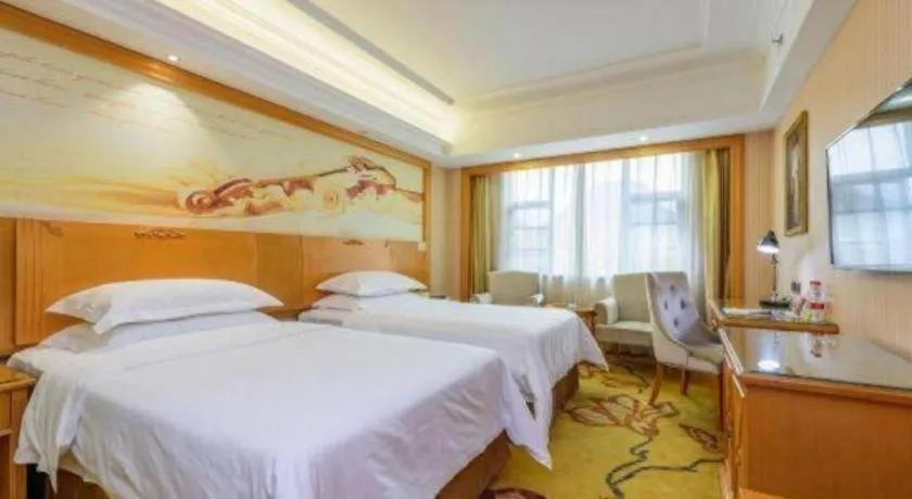 Bed in Vienna Hotel Guangxi Liuzhou Xijiang Vientiane City