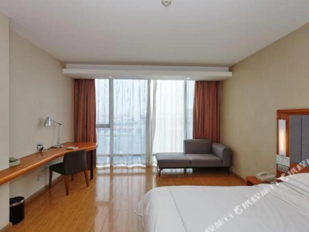 Bed in Warmly Hotel Suzhou Shuanghuwan