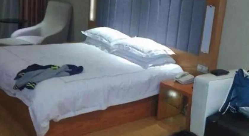 Bed in Warmly Hotel Suzhou Shuanghuwan