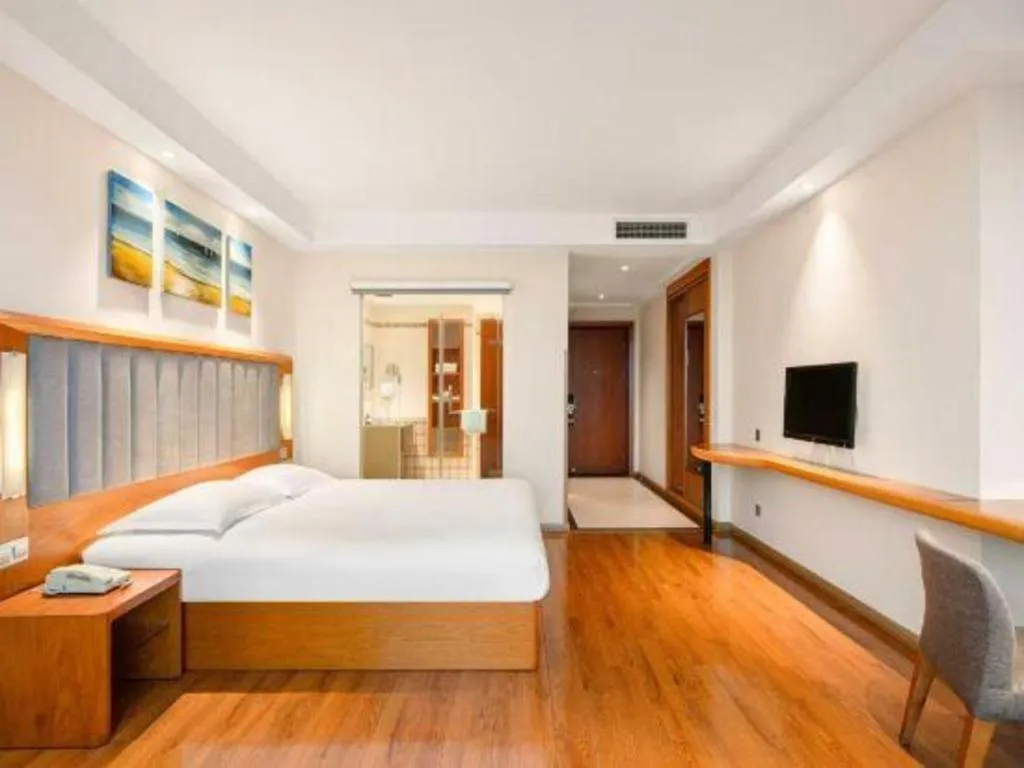 Bed in Warmly Hotel Suzhou Shuanghuwan