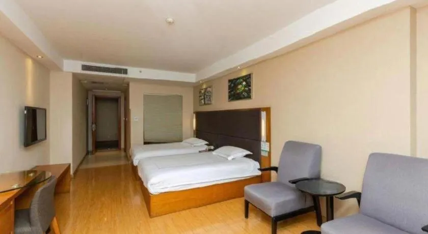 Bed in Warmly Hotel Suzhou Shuanghuwan