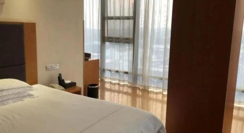 Bed in Warmly Hotel Suzhou Shuanghuwan