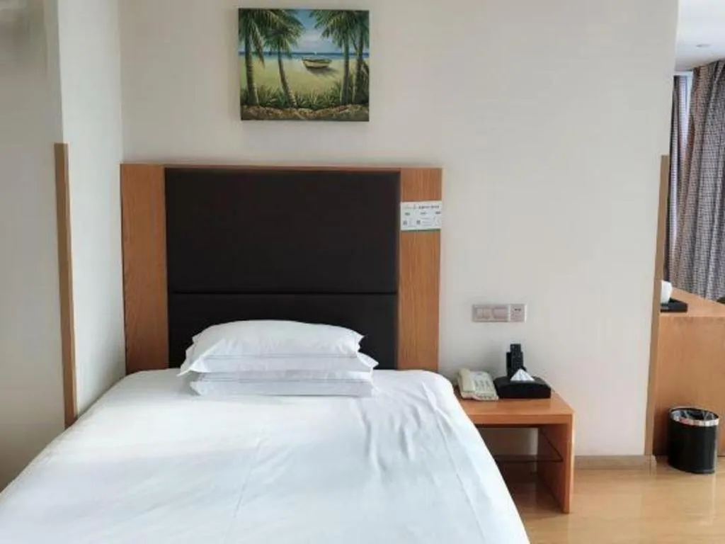 Bed in Warmly Hotel Suzhou Shuanghuwan