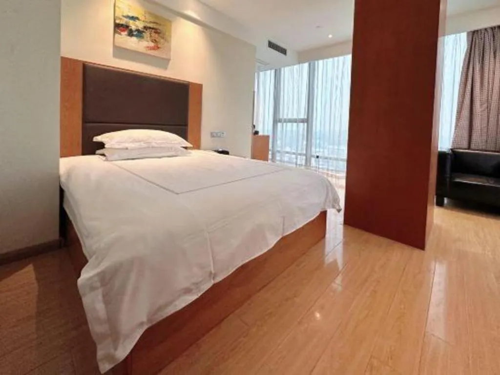 Bed in Warmly Hotel Suzhou Shuanghuwan