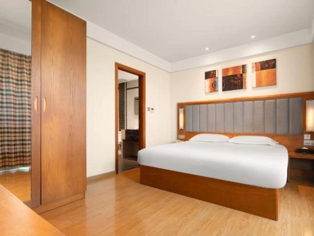 Bed in Warmly Hotel Suzhou Shuanghuwan