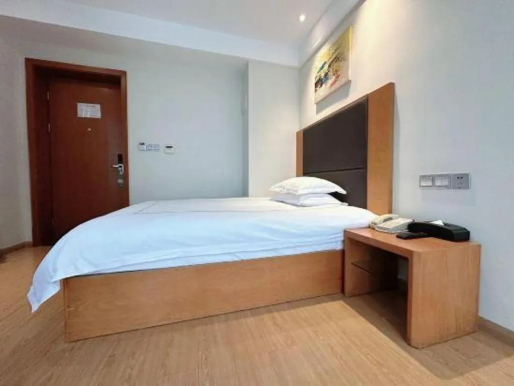 Bed in Warmly Hotel Suzhou Shuanghuwan